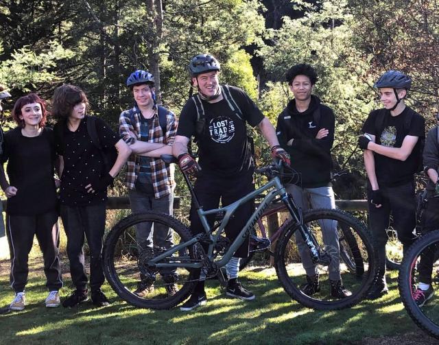 A group of people with bikes